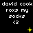 Pixel art animation of repeated text and symbols on a black background with yellow star-like elements appearing and changing.