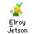 Pixelated character with yellow hair and green hat, wearing green tunic and orange collar, giving thumbs-up gesture against gray background.