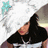A pixelated image shows a person with dark hair wearing black clothing, holding a light blue star-shaped object against a white background.