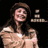 Pixelated static image of a person with long dark hair, bare shoulders, and light skin tone against black background.