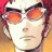 Pixelated anime-style character with red hair and orange-tinted glasses on left, black background with white text "Anime IM" and stylized "cOM" logo on right in a 48x48 contact sheet frame.