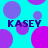 Cyan background with overlapping purple and magenta circles; four instances of the text 'KASEY' in dark blue pixelated font.