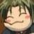 Pixelated close-up of a character's face with closed eyes, pink cheeks, and light brown hair against a blurred green background.