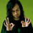 six pixelated images showing a person with long dark hair in various poses and backgrounds, including green, white, and black backdrops