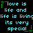 Pixelated cyan text on black background with green star accents, repeating 'love is life and life is living its very special' in a