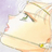 A pixelated image of a light-colored, rounded object with green accents and subtle pink highlights against a pale background.