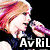 A woman with pink and blonde hair sings into a purple microphone, with partial text 'AvRiL' below her.