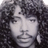 Static 48x48 pixel icon showing a grayscale portrait of a person with curly hair and visible facial features, rendered in low-resolution dithering style on a transparent background.