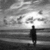 Animated sequence showing a person on a beach with waves, transitioning to multiple figures surfing and then a flower with text.
