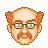 Pixelated profile of a man with light brown hair, glasses, and a mustache against a gray background.