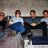 Static 48x48 pixel icon showing a group of five figures in dark clothing with blue accents against a light background, rendered at low resolution with visible pixelation and dithering.