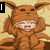 Pixelated character in brown fox costume with multiple tails, smiling and holding ears against beige background.
