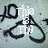 A static image shows a stylized black 'LO' logo with a heart shape, overlaid with white text reading 'This is TM' on the left and 'For TM' on the right, against a light blue background.