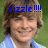Pixelated image of a person with light brown hair wearing a blue shirt, overlaid with bright blue text reading "sizzle !!!!" against a green background.