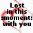 Black text reads 'Lost in this moment: with you' over a pixelated red heart shape on a white background.