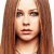 Pixelated close-up of a person with long brown hair, light skin tone, and neutral expression against plain background.