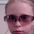 A person with light hair and dark sunglasses appears in a of four , showing slight variations in head position and background
