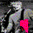 Pixelated figure with multicolored accents on a dark background, holding a bright pink heart-shaped object.
