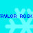 Pixelated cyan background with light blue snowflakes and repeated dark blue text reading "AYLOR ROCK" in two horizontal