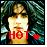 Pixelated static image of a figure in light clothing holding a red banner with 'HOT' text against dark foliage background.