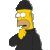 Pixelated cartoon character with yellow skin, black beanie, and dark jacket against gray background.