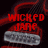 Two side-by-side animated frames show red text on a dark background with red smoke effects; the left frame reads "WICKED JANE" and the right frame reads "BASS BACKUP VOCALS".
