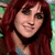 A woman with long red hair and a light blue top appears in three showing slight head movement against a green background