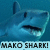Pixelated shark head with open mouth against blue background, text "MAKO SHARK!" below in blocky font.
