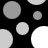 Black background with scattered gray and white circles of varying sizes, some partially cut off at edges.