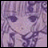 A pixelated anime-style character face with purple hair and large eyes on the left, next to stylized text reading "Anime IM" above a smaller "com" on a black background.