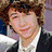 Six distinct pixelated images of a young person in various poses and settings, including formal attire, beachwear, and casual clothing.