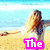 A pixelated beach scene with a woman in white clothing and long hair, standing on sand near water.