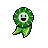 Green pixelated circular icon with white border around a smiling face, two black eyes, and a black mouth, attached to a green ribbon-like tail on a gray background.