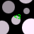 Black background with scattered gray and white circles; four green triangular shapes appear on top of some circles.