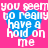 A static image with four identical blue heart shapes on a pink background, each containing white text reading "you seem to really have a hold on me".