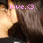Pixelated image with pink text 'love.<3' overlaid on a blurred background featuring warm tones and dark shapes.