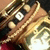 Pixelated close-up of a character's face with brown hair, large eyes, and light skin tones against dark background.