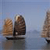 Pixelated static image of three sailboats on calm water under a light blue sky, with brown sails and dark hulls.