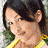 A 4-frame contact sheet of a woman in a yellow top with varying expressions and poses against green foliage, displayed on a gray transparent background.