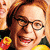 A 2x2 contact sheet of three animated frames showing a cartoon character with red hair, glasses, and multiple expressions across different colored backgrounds.