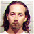 A 2x2 contact sheet of a mugshot-style image featuring Paul Reubens with long brown hair, mustache, and goatee, overlaid with green text labels including "Paul," "Reubens," "Celebrity Original MugshotsIcons.com" on a gray striped background.