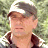 Two side-by-side frames of a pixelated image showing two men outdoors with green foliage background, one wearing cap and sunglasses, the other in glasses without cap.