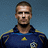 Two side-by-side pixelated images of a person in a blue sports jersey with yellow accents and a soccer ball emblem, against a solid blue background.