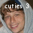 A person in a light gray hooded garment with brown hair, smiling broadly across three showing text changes above the head