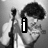 Black-and-white four- shows a person with curly hair holding a microphone, displaying text and gestures