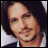 Two pixelated images of a man with long dark hair and facial stubble, one above the other, next to text reading "Johnny my anti-drug" on black background.