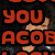 A pixelated image shows a person in dark clothing with red text overlay reading 'YOU ACOB' on the left side.