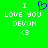 Green background with white pixelated text reading "I LOVE YOU DEVON" and a blue heart symbol above the word "LOVE", alongside identical static text below.