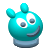 Pixelated teal character with large white eyes, dark gray pupils, and a curved dark gray mouth, featuring a small rounded ear on the left and a taller rounded protrusion on top, set against a solid light gray background.