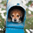 A pixelated dog peers from a blue container against green foliage, with cyan text reading 'send me to your heart :)' on a solid blue background.